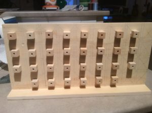 Gluing the holed cubes to the board