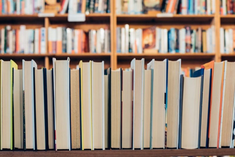 Picture of books on a table and shelves