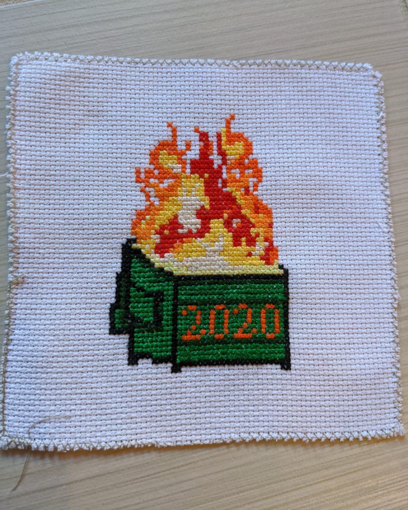 Cross stitch work of a 2020 dumpster fire