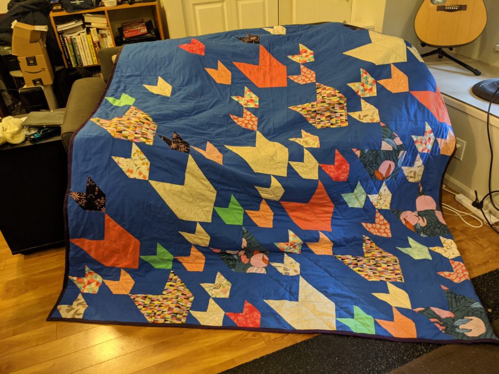 Finished Pacific Crest quilt on a couch