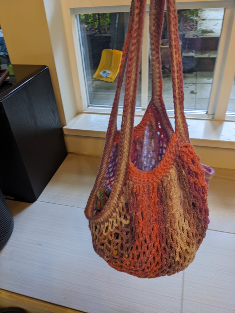 Edda bag, crocheted, holding several other Edda bags